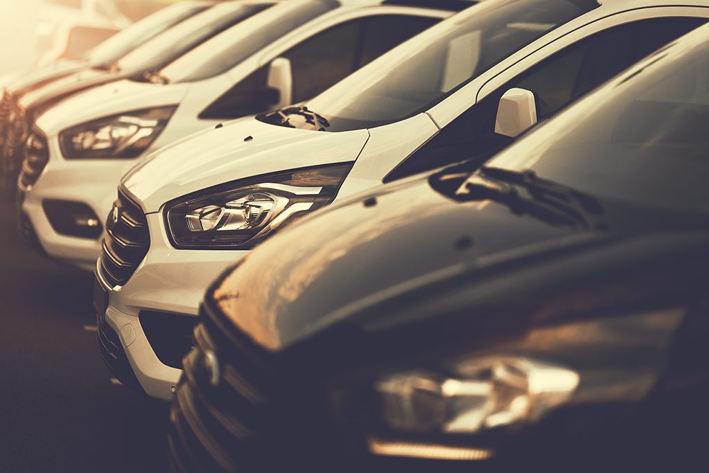 Work trucks or a company fleet lined up clean at the wash